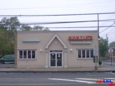 a small building with a sign on the front