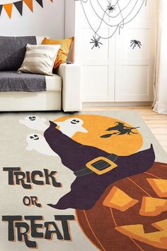 a halloween themed living room with a trick or treat rug