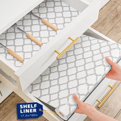 a drawer with handles that are open to show the drawers and handle for cutting paper