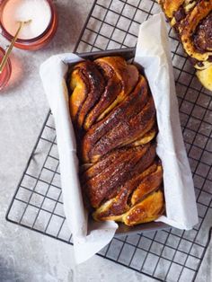 a loaf of bread sitting on top of a cooling rack