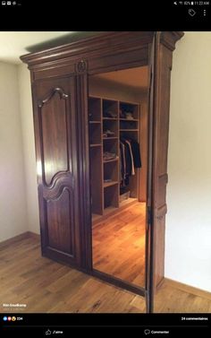 an image of a large closet in the middle of a room with wooden floors and doors