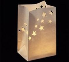 a paper bag with stars on it and some lights in the shape of small bags