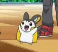 an animated image of a person standing next to a pokemon pikachu figure on the ground