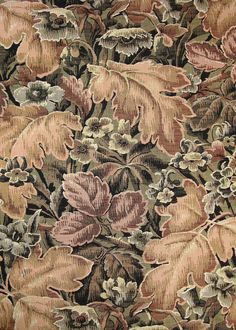 a close up view of a floral design on fabric with many different colors and sizes