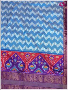 Step into this charming elegance of Kanchipuram Silk light blue saree, festooned with Ikkat pattern on its body. The blue foundation displays distinctive ikkat pattern, creating an unique and stunning look. Further it snuggled across the purple border featuring animal motif series that radiates zest for life. The vibrant purple pallu with animal motis in florals, woven in gold zari exudes perfect grandeur. The saree is accompanied by ikkat purple zari-bordered blouse, which adds opulence. Silk m Blue Silk Pre-draped Saree For Traditional Ceremonies, Blue Silk Traditional Wear With Printed Border, Traditional Blue Pre-draped Saree For Festivals, Transitional Blue Silk Pre-draped Saree, Blue Banarasi Silk Traditional Wear With Printed Border, Blue Pre-draped Saree With Zari Weaving For Navratri, Blue Art Silk Pre-draped Saree With Traditional Patterns, Blue Pre-draped Saree With Motifs For Festivals, Blue Saree With Printed Border For Festivals