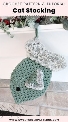 a crochet stocking hanging from a fireplace with text overlay that reads, crochet pattern & video cat stocking