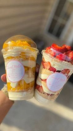 two plastic cups filled with different types of desserts on top of eachother