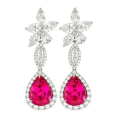 18kt white gold cluster pink tourmaline and diamonds earrings, features 12.70 (6.02+6.68ct) of two pink tourmalines and 10.15ct of 6 mq & rd diamonds. Luxury Pink Earrings With Brilliant Cut, Luxury Pink Sapphire Earrings For Formal Occasions, Pink Diamond Accent Earrings For Formal Occasions, Formal Pink Earrings With Diamond Accents, Luxury Pink Sapphire Earrings, Wedding Pink Sapphire Earrings, Fine Jewelry Earrings, Hot Pink Earrings, Diamonds Earrings