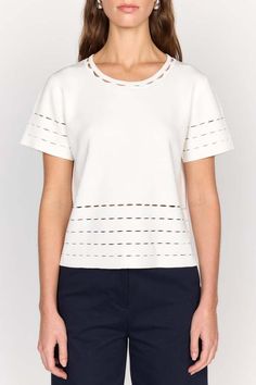 The clio top is an elevated stable white tee. this top is cut in a knit blend and features a unique laser cut detailing at the neck sleeve and hem.    composition: knit blend  care: dry clean only  imported. White Fine Knit Top With Short Sleeves, White Fine Knit Short Sleeve Top, White Pointelle Knit Crew Neck Top, Elegant Crew Neck Top In Pointelle Knit, Open Knit Workwear Tops, Open Knit Tops For Workwear, Open Knit Top For Work, White Crew Neck Top In Pointelle Knit, Modern Crew Neck Knit Top For Spring