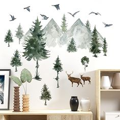 the wall is decorated with trees, birds and deers in watercolor on white paper