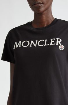 Showcase your brand allegiance in this soft cotton T-shirt detailed with an iconic Moncler patch and embroidered lettering. Crewneck Short sleeves 100% cotton Machine wash, dry flat Imported Designer Clothing Black Cotton T-shirt With Embroidered Logo, Black Cotton Top With Logo Patch, Cotton T-shirt With Appliqué Logo, Classic Black Top With Logo Patch, Casual Cotton Tops With Appliqué Logo, Cotton Graphic Tee With Appliqué Logo, Black Crew Neck Top With Appliqué Logo, Black Cotton Tops With Appliqué Logo, Cotton T-shirt With Appliqué Logo For Streetwear