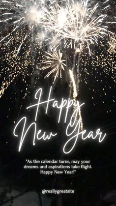 fireworks with the words happy new year written in white and black lettering on it,