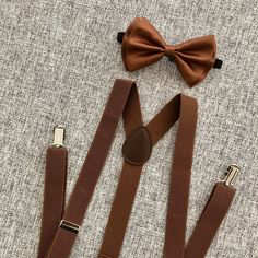 Elegant Brown Belts And Suspenders For Formal Occasions, Fitted Belts And Suspenders With Bow For Party, Classic Brown Suit And Tie Accessories For Father's Day, Bow Tie And Suspenders Set For Father's Day Party, Classic Suspenders For Suit And Tie At Party, Elegant Party Belt With Bow, Brown Bow Suit And Tie Accessories For Party, Classic Bow Tie With Suspenders For Party, Classic Party Bow Tie With Suspenders