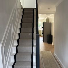 the stairs in this house are white and black