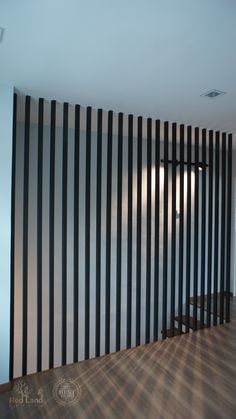 an empty room with black and white striped walls