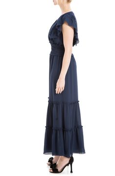 Lightweight fabric is shaped into this flowy crepe maxi dress designed with tiers of ruffles and smocked detailing. Surplice V-neck Short flutter sleeves 97% polyester, 3% spandex Machine wash cold, line dry Imported Model stats: 5'10", 32" bust, 25" waist, 36" hip. Model is wearing size Small. Chic Crepe Maxi Dress, Tiered Maxi Dress With Smocked Back And Flowy Skirt, Flowy Ruched Tiered Skirt Maxi Dress, Summer Crepe Maxi Dress, Spring Crepe Maxi Dress, Flowy Maxi Dress With Ruffled Skirt, Chic Chiffon Maxi Dress With Ruffled Straps, Chic Ruched Ruffle Maxi Dress, Chiffon Maxi Dress With Ruffled Straps And Details