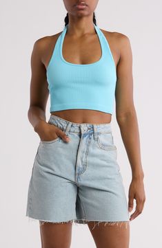 Soft, stretchy and seamless fabric defines this halter top that's the perfect blend of trendy and comfortable. 14" length (size Small) Halter neck Sleeveless, with cutaway shoulders Machine wash, tumble dry Imported Light Blue Halter Top, Stretch Seamless Crop Top Halter, Seamless Halter Crop Top For Workout, Stretch Seamless Cropped Halter Top, Seamless Stretch Cropped Halter Top, Seamless Crop Top Halter For Workout, Solid Seamless Halter Crop Top, Seamless Solid Color Crop Top Halter, Seamless Workout Halter Crop Top