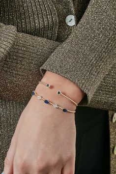 14K white and yellow gold Bujukan diamond and blue sapphire bangle. Editorial Jewelry, Sapphire Bangle, Blue Sapphire Bracelet, Jewelry Editorial, Modern Bracelets, Gold Ornaments, Sapphire Bracelet, Gold Bracelet Chain, Diamond Bangle