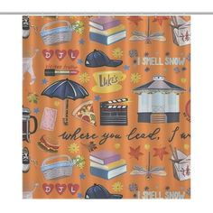 an orange shower curtain with books and umbrellas