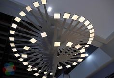 a circular light fixture hanging from the ceiling