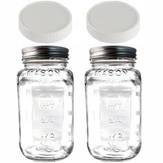 two mason jars with lids are sitting side by side