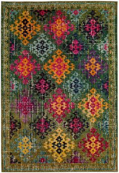 a green rug with colorful flowers on it