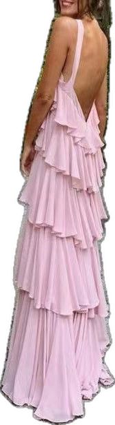 the back of a woman's pink dress with ruffles