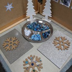 snowflakes and other decorations are on the floor