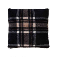 a black and white plaid pillow on a white background