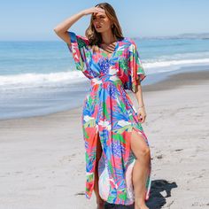 Embrace weekend vibes in the Bright Tropical Smocked Maxi Dress. Perfect for brunch with friends or a family gathering, its easy-going style and bright print make every day feel like a getaway. Whether you're attending a garden party or enjoying a beachside dinner, this versatile dress is your go-to choice for any warm-weather occasion. Product code: CAA05A4D165EE Multicolor Beach Dress For Vacation Brunch, Colorful Beach Dress For Spring, Tropical Dress For Vacation Brunch, Tropical Dresses For Vacation Brunch, Tropical Dresses For Brunch On Vacation, Colorful Beach Cover-up Dress For Spring, Summer Tropical Dress With Smocked Back, Green Bohemian Beach Dress For Brunch, Casual Multicolor Print Vacation Dress