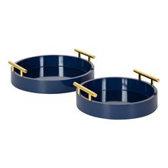 two round blue trays with gold handles