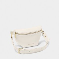 Our Maya Belt Bag in off white is here to accompany you on every summer adventure. With a captivating selection of three warm-weather ready colorways, this vegan leather gem effortlessly blends fashion with functionality. The adjustable wide strap guarantees a comfortable fit, while the internal pocket ensures effortless organization of small essentials. The gold-tone zip fastening not only adds a touch of elegance but also secures belongings, allowing for carefree dancing at festivals and beyon