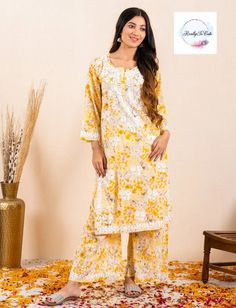 This is  soft hand-embroidered chikankari Kurti and palazzo set. It gives a very smooth feel to your skin and hand embroidery on this Kurti makes it set apart from other Kurtis. TOP Fabric - MulMul Neck Type: Round Neck BOTTOM FABRIC- rayon with hand embroidery  Size - Size Available - 38- 44 inch size is measured is Bust size. If you need any clarification regarding Size Please contact me Spring Festive Salwar Kameez With Gota Work, Zari Work Pant Set For Summer, Spring Salwar Kameez With Gota Work And Long Sleeves, Spring Resham Embroidered Straight Kurta Palazzo Set, Bollywood Style Kurta With Gota Work For Spring, Spring Long Sleeve Salwar Kameez With Gota Work, Spring Yellow Palazzo Set With Resham Embroidery, Resham Embroidery Pant Set With Straight Kurta, Anarkali Sharara With Gota Work For Spring