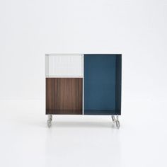 the sideboard is made out of wood, metal and glass with two different colors