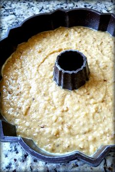 a cake pan filled with batter on top of a counter