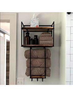 two shelves with towels and bottles on them