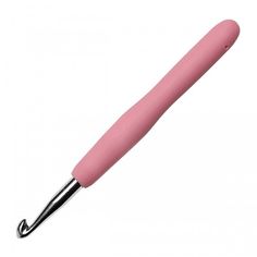 a pink ballpoint pen sitting on top of a white table next to a black handle