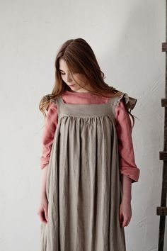 Victorian style inspired pinafore dress with flutter sleeve made from 100% soft and washed Oeko-Tex certified linen Details: - Composition: 100% Oeko-Tex certified linen - Colour: Natural - Coconut buttons down the back - Size: XS-S, M, L-XL - Medium weight linen - Linen care: machine wash gentle; tumble dry low, ironing optional - The price is for one pinafore dress, other pictured items are not included Linen Ruffle Dress For Daywear, Linen Daywear Dress With Ruffles, Relaxed Fit Linen Dress With Ruffles, Relaxed Fit Linen Ruffle Dress, Dress With Wings, Pretty Apron, Dress With Flutter Sleeves, Dress Linen, Womens Aprons