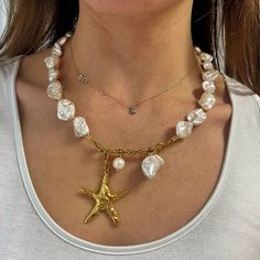 "Underwater Muse" necklace bridal edition  ⚜️super impressive summer Statement boho chic necklace .  This beautiful y lariat necklace  is made of pearly white irregular shape beads made of shells ( imitation pearls ) these beads are not fresh pearls but still made of natural elements known also as "shell pearl"   It is also decorated with a large gold plated 24k zamac star fish charm and a large freshpearl .  It easily closures at the front with a steel closure. Ideal Bohemia bridal jewelry.  It is a piece with a luxurious finish .  total length aprox 46 cm ( without the hanging part )  Star fish size aprox: 4.2 x 5 cm  it comes in two metal color tones . that means the metal details will be either in gold or silver tone . all rest parts remain the same  Nickel  free  🔆you may also check Bohemian Pearl Necklaces With Adjustable Chain, Bohemian Lariat Pearl Jewelry, Bohemian Pearl Necklace With Adjustable Chain, Elegant Pearl White Jewelry For Beach, Elegant White Shell Necklace For Summer, Pearl Dangle Lariat Necklace, Pearl Lariat Necklace With Clavicle Chain, Bohemian White Pearl Chain Necklace, Elegant Summer Beach Necklaces