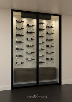 two glass cases with wine bottles in them on the side of a wall next to a wooden floor