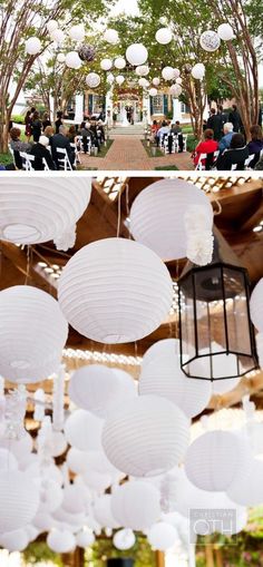 white paper lanterns hanging from the ceiling at a wedding