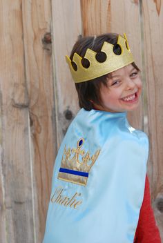 "Looking for a Prince cape? This is the cutest personalized and crown for your little one's B-day party...King Medieval, or Knight. You can choose any 2 colors for the cape and personalization Kids are crazy about playing pretend, and this cape will take him back in time playing Medieval/ King/ Prince. Driving their imagination loose, and enjoying to be a kid. I can design any cape you would like!! The capes are made with a beautiful double sided Satin (Choice out of two colors) and all applique King Costume For Kids, Prince Cape, King Cape, Medieval Cape, Diy Birthday Crown, Royal Cape, Medieval King, Carnival Crafts, Super Hero Birthday