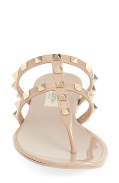 The Italian luxury fashion house's iconic Rockstuds make an appearance on this glossy jelly sandal designed to elevate your casual ensembles. Synthetic upper, lining and sole Made in Italy Designer Shoes Designer Studded Sandals For Summer, Designer Spiked Sandals For Summer, Luxury Spiked Sandals For Summer, Jelly Sandals, Designer Sandals, Italian Luxury, Sandal Women, Valentino Garavani, Designer Shoes