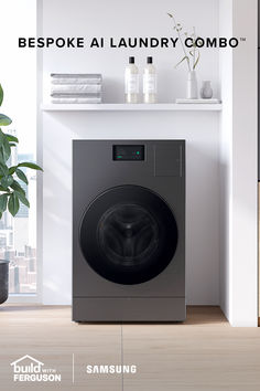 a washing machine sitting in front of a window with the words bespoke laundry combo on it