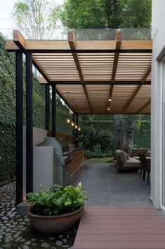 an outdoor kitchen and dining area is shown