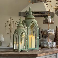 a table topped with lots of lit candles