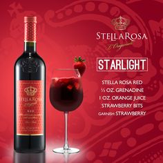 a bottle of red wine next to a glass with a strawberry on the side and an advertisement for stella rossa