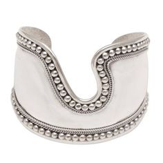 Sterling silver wire is handcrafted for an elegant accessory that encircles the wrist. The creative shape of this cuff bracelet features a shining, high-polish finish bordered by bubble and rope motifs. Designed by Cahya Krisna, the cuff possesses a royal vibe, perfectly accentuating a variety of outfits. Wide Cuff Bracelets, Silver Chain Bracelet, Sterling Silver Cuff Bracelet, Bracelet Crafts, Sterling Silver Cuff, Elegant Accessories, Silver Cuff Bracelet, Silver Bangles, Silver Cuff