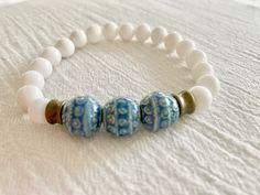 Beaded Bracelet Unique Jewelry Mens Bracelets Handmade - Etsy White Bohemian Stretch Bracelet For Meditation, Bohemian Round Stretch Bracelet For Beach, Bohemian Stretch Bracelet For Beach, Handmade White Stretch Bracelet For Meditation, Bohemian Hypoallergenic Bracelets, Bohemian Blue Hypoallergenic Bracelets, Spiritual White Friendship Bracelets For Beach, Bohemian Blue Stretch Bracelet For Everyday, White Bohemian Stretch Bracelet For Friendship