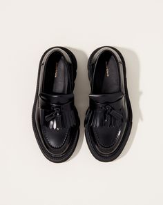 Tassle loafer in glossy all-black cow leather with wedge calf hair heel on platform vibram sole.Fit: Japanese sizing, see conversionMaterial: Cow leather, vibram soleOrigin: JapanWhy we Covet: Transcendence through craftsmanship